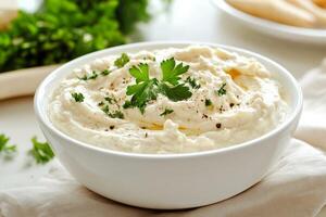 Indulge in these deliciously creamy mashed potatoes generously topped with fresh parsley, perfect for any meal photo