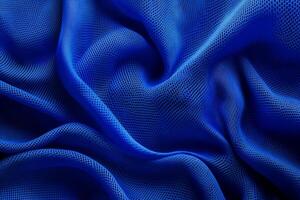 The highquality blue fabric texture is ideal for sports jerseys and is specifically designed to showcase its versatility and durability for a wide range of athletic wear and sports apparel photo