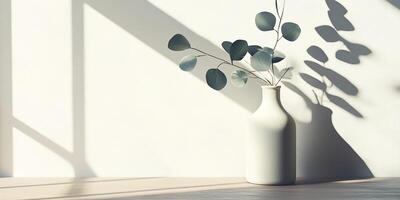 A beautiful and serene display showcases a striking white vase elegantly filled with eucalyptus, casting gentle and calming shadows in the bright sunlight against a soft, neutral background photo