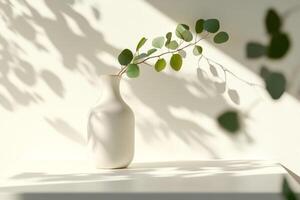 This serene composition showcases a simple vase with delicate foliage, casting gentle shadows on a neutral shelf, ideal for those who value minimalism and a calming, elegant atmosphere photo