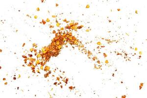 dried red chili pepper flakes and seeds isolated on white background photo