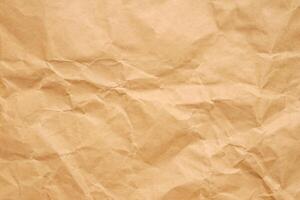 Abstract crumpled and creased recycle brown paper texture background photo