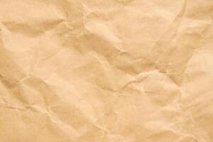 Abstract crumpled and creased recycle brown paper texture background photo