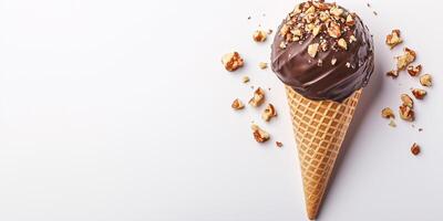 Ice cream cone hand-dipped in chocolate and rolled in nuts photo