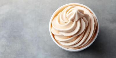 Banana-based soft serve swirled into cup at vegan ice cream shop photo