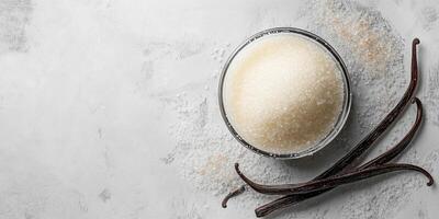 Vanilla bean seeds mixed into sugar in a glass container photo