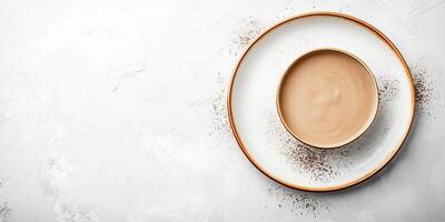 Sea salt caramel confections used to create a border around empty plate photo