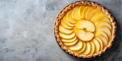 Apple tart with concentric slices of fruit on open-faced pastry photo