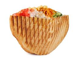 Doner with a crispy crust and tasty filling with sauce isolated on a white background. photo