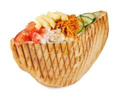 Doner with a crispy crust and tasty filling with sauce isolated on a white background. photo