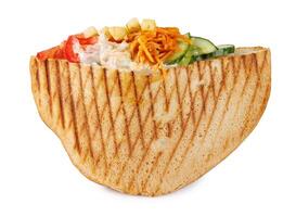 Doner with a crispy crust and tasty filling with sauce isolated on a white background. photo