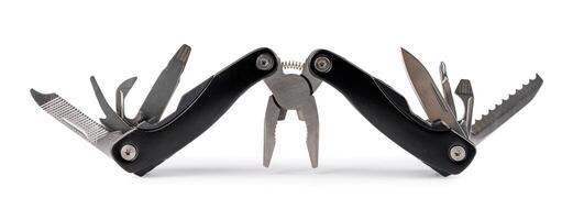 Steel multitool isolated on white background. Opened multitool with pliers, file, blade, screwdriver, bottle opener and saw, with a white background. Multi tool with expanded tools and pliers photo