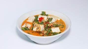 Tumis kacang panjang or stir fried long bean and tofu known as simple asian dish with light and savoury taste. photo