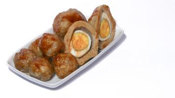 Pentol is a typical Indonesian spicy snack made from beef and tapioca flour. photo