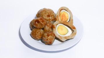 Pentol is a typical Indonesian spicy snack made from beef and tapioca flour. photo