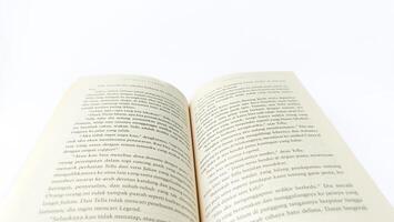 stack of colorful books on white background, open book, stack of books isolated on background, education, read, study, school, library, dictionary. photo