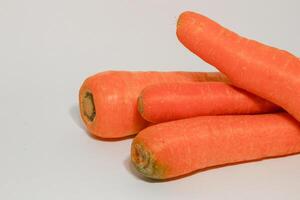 Group of fresh carrots isolated on white background. photo