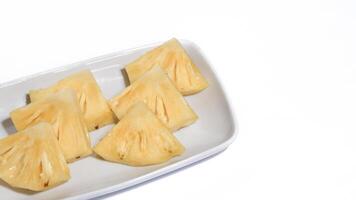 fresh juicy pineapple pieces isolated on white background photo