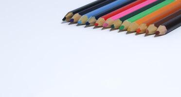 Color pencils isolated on white background photo