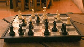 Chess pieces on the chessboard. Chess Game. Close Up Playing a Game of Chess. Strategy game that requires concentration and intelligence. photo