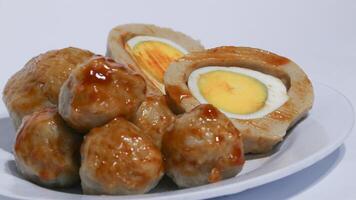 Pentol is a typical Indonesian spicy snack made from beef and tapioca flour. photo