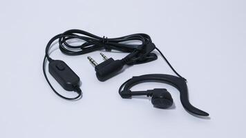 Black portable radio ht or walkie talkie in a white background photo