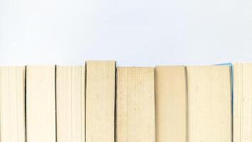 stack of colorful books on white background, open book, stack of books isolated on background, education, read, study, school, library, dictionary. photo