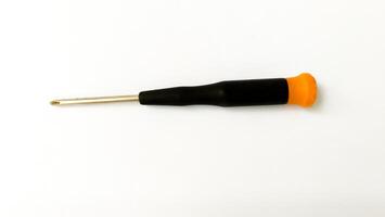 Set of red-orange-blue screwdrivers isolated on white background. Builder's and electrician's tools. Equipment. Set of steel screwdriver bits with red and black plastic handles. photo