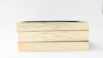 stack of colorful books on white background, open book, stack of books isolated on background, education, read, study, school, library, dictionary. photo