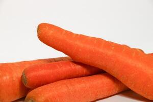 Group of fresh carrots isolated on white background. photo