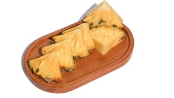 fresh juicy pineapple pieces isolated on white background photo