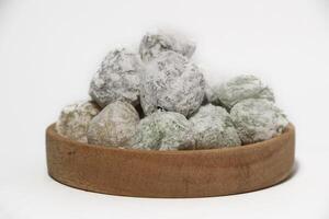 Mochi - trendy and sweet dessert, Mochi cake on a plate on a white background. photo