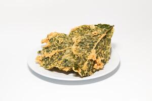 Keripik Bayam. Amaranth Chips. This savory snack made of green amaranth leaves floured and deep fried. photo