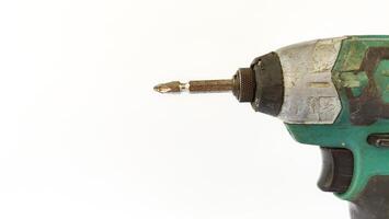 Cordless drill with drill bits, white background for copy space. photo