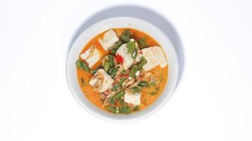 Tumis kacang panjang or stir fried long bean and tofu known as simple asian dish with light and savoury taste. photo