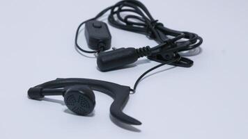 Black portable radio ht or walkie talkie in a white background photo