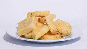 fresh juicy pineapple pieces isolated on white background photo