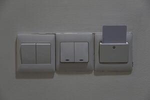 Hotel open room card system with light switch white wall. Horizontal photo