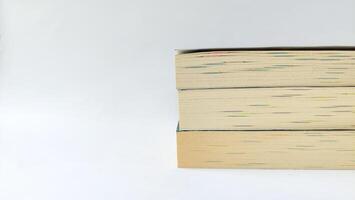 stack of colorful books on white background, open book, stack of books isolated on background, education, read, study, school, library, dictionary. photo