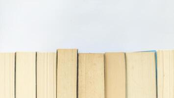 stack of colorful books on white background, open book, stack of books isolated on background, education, read, study, school, library, dictionary. photo