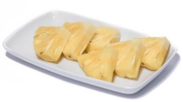 fresh juicy pineapple pieces isolated on white background photo