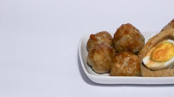 Pentol is a typical Indonesian spicy snack made from beef and tapioca flour. photo