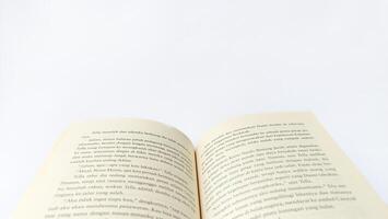 stack of colorful books on white background, open book, stack of books isolated on background, education, read, study, school, library, dictionary. photo