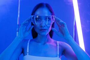 artificial intelligence, girl in the image of a virtual assistant in transparent glasses photo