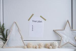 Motivational paper note YEAR PLAN list. Goals setting concept. Strategy for self development improvement. Inspirational Planning better healthier life. Visual motivation photo