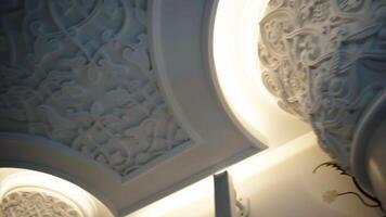 White painted columns. Scene. Beautiful architecture inside the room and beautiful carved patterns on the walls. video