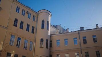 Architecture of old residential building of city. Action. Beautiful residential building in area of ancient city. Facade of residential building with right architecture video