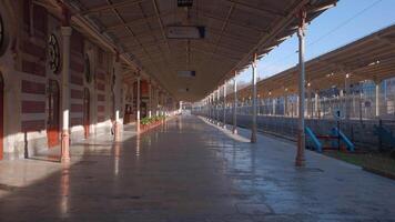 Early morning at the empty railway station. Action. Sunshine on the empty platform. video