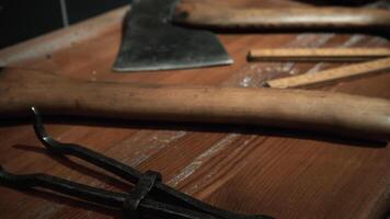 Big axes. Media. Huge Russian axes that lie on the tables and are removed at a close angle. video