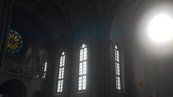 An Orthodox church taken from the inside. Action. A bright holy room with a cross, paintings on the stacks and a window and a hall. video